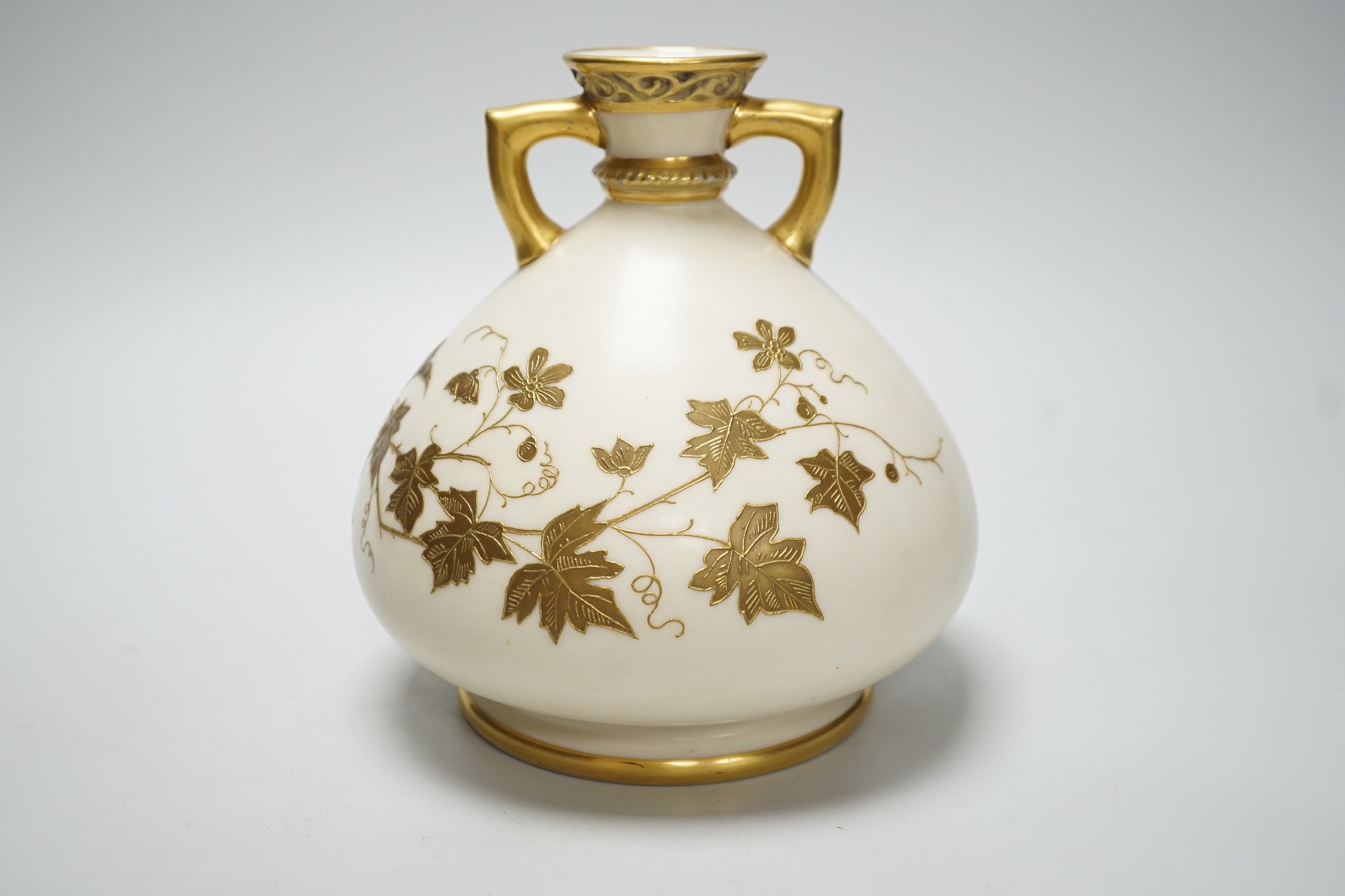 A Royal Worcester gilded vase of bulbous form, 17cm